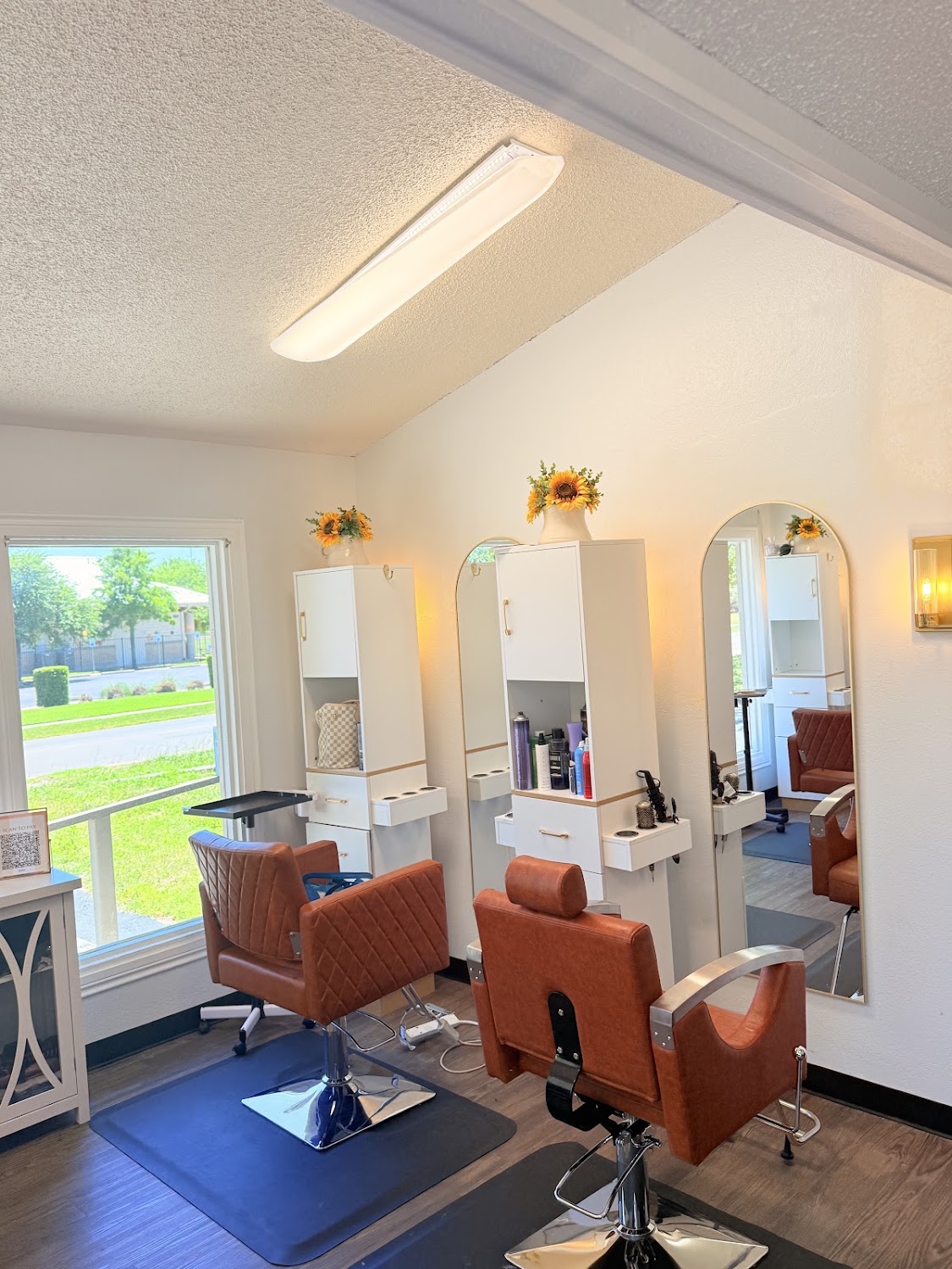 Inside The Luxe with arched mirrors and daylight